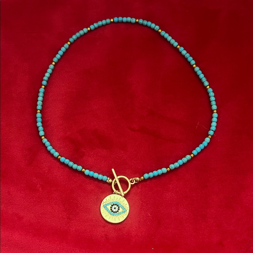 Turquoise Beaded Necklace with Gold Eye Pendant